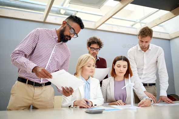 business people discussing green energy project - Stock Photo - Images