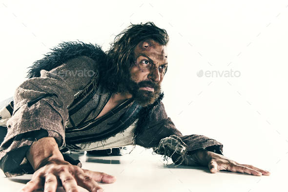 Portrait of a brutal bald-headed viking in a battle mail posing against a white background. - Stock Photo - Images