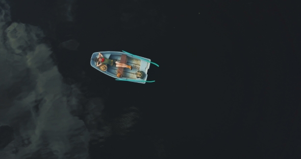 Boy Lying in Old Boat
