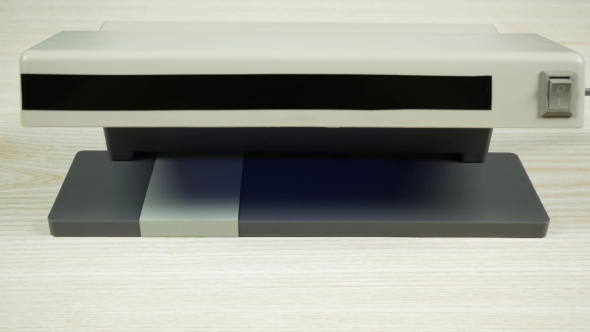 One Hundred Dollar Bill in the Currency Detector. alt