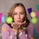 Woman Blowing Confetti and Smiling - VideoHive Item for Sale