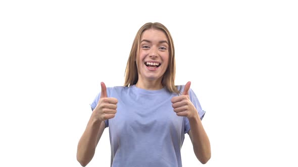 Slow Motion Happy Caucasian Young 25s Woman Appear Bottom Showing Thumbs Up Giving Approval Positive alt