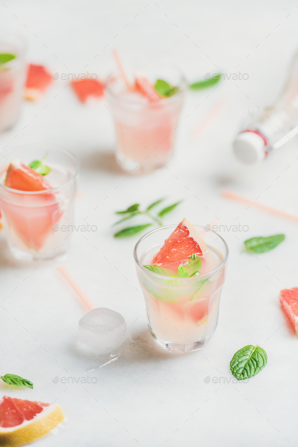 Cold refreshing summer alcohol cocktail with fresh grapefruit - Stock Photo - Images