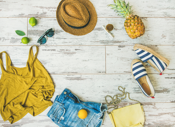 Colorful summer fashion outfit flat-lay over parquet background, copy space - Stock Photo - Images