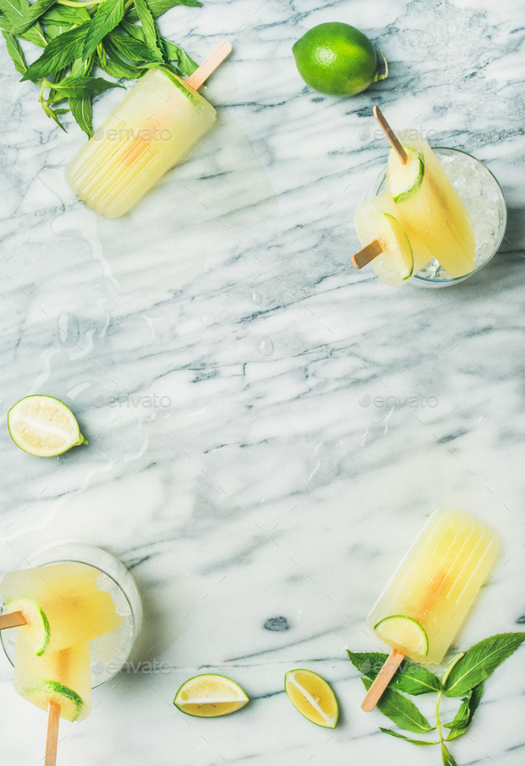 Summer refreshing lemonade popsicles with lime and mint leaves - Stock Photo - Images