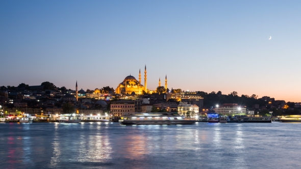 View of Istanbul Cityscape with Suleymaniye Mosque with Tourist Ships Floating at Bosphoru alt
