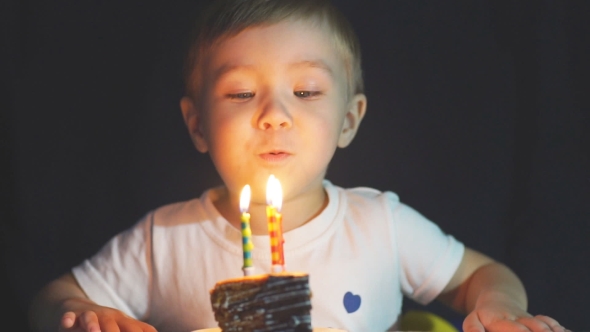 Little Boy Blows Out Candles on Birthday Cake at Party, Stock Footage