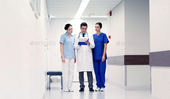 group of medics at hospital with clipboard - Stock Photo - Images