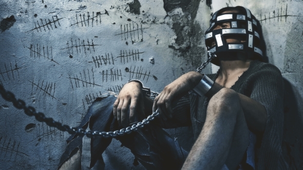 Prisoner in Chains Eats Food Brought alt