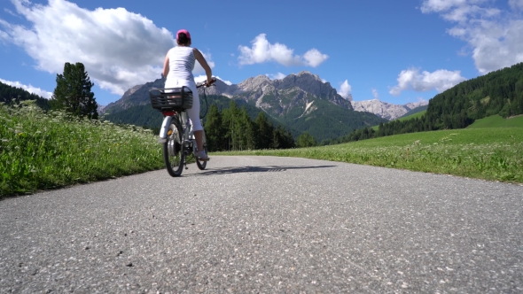 Women on Electric Eco Bike Cycling Italy Dolomites Alps alt