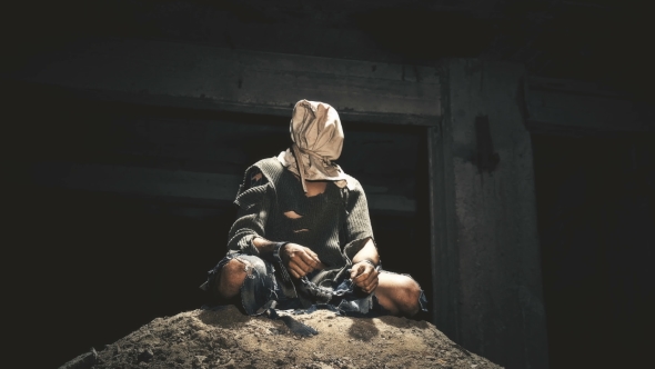 a Prisoner in Chains Is Closed in the Basement Where a Little Light Penetrates alt