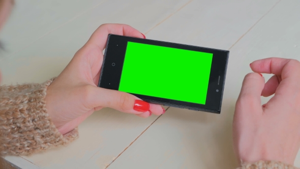 Woman Using Smartphone with Green Screen