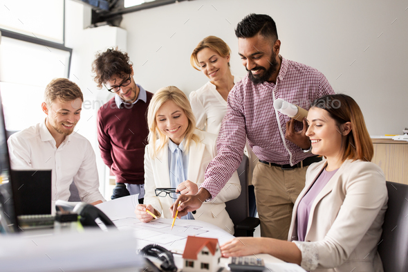 business team discussing house project at office - Stock Photo - Images
