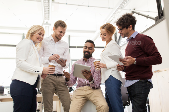 business team with tablet pc and coffee at office - Stock Photo - Images