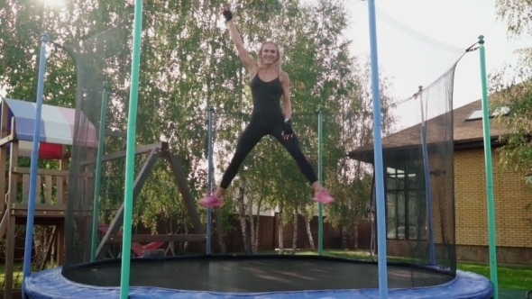 Woman Jumping on a Trampoline alt