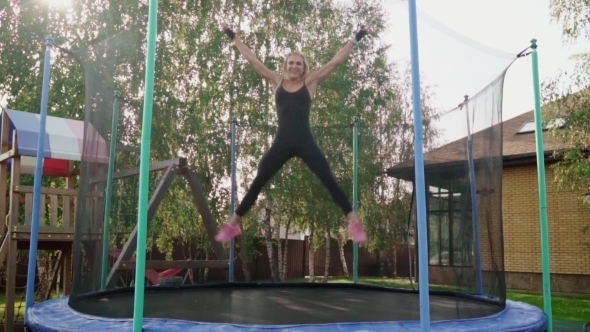 Woman Jumping on a Trampoline