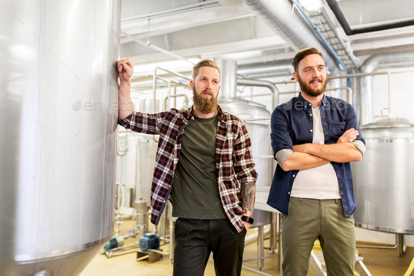 men at craft brewery or beer plant - Stock Photo - Images