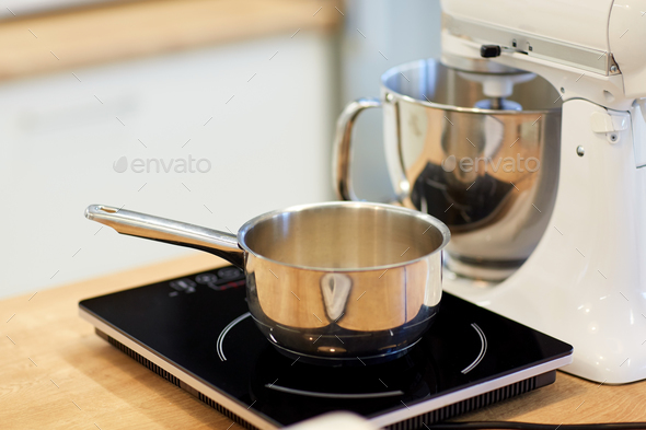 electric mixer and pot on stove at kitchen