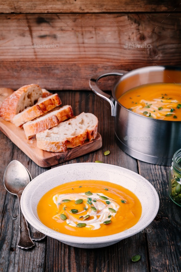 Homemade butternut squash soup with cream and seeds