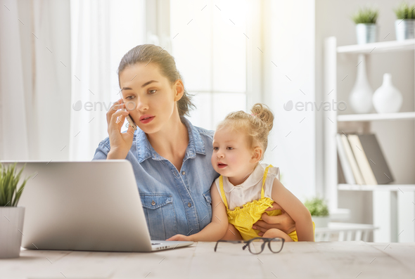 mother with toddler working