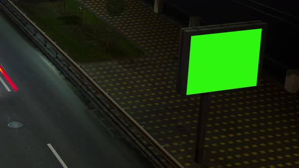 Headlights Lights Of Passing Cars At Night, Advertising Billboard, Green Background, Time Lapse