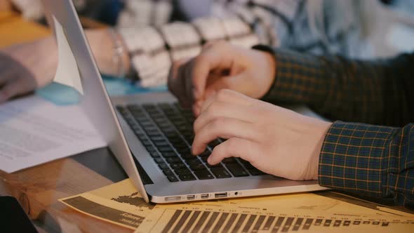 Close-up Shot of Male Code Developer Hands Typing, Working Behind Office Table with Laptop at Modern alt