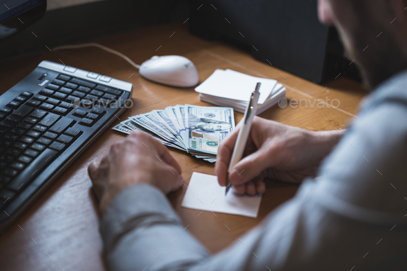 Businessman is counting dollars banknotes, business and financial background - Stock Photo - Images