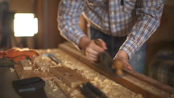 The Carpenter Sweeps the Shavings Off the Wood with Wood.