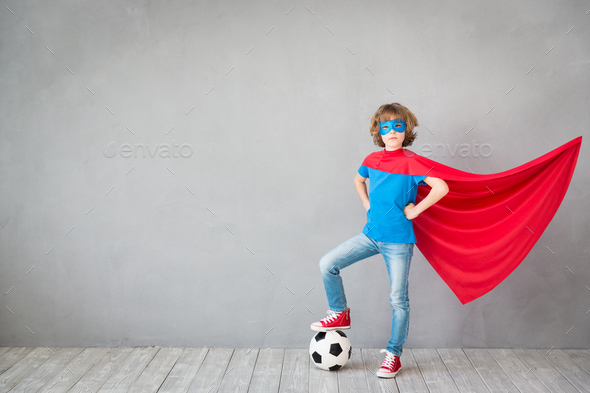 Child pretend to be soccer superhero - Stock Photo - Images