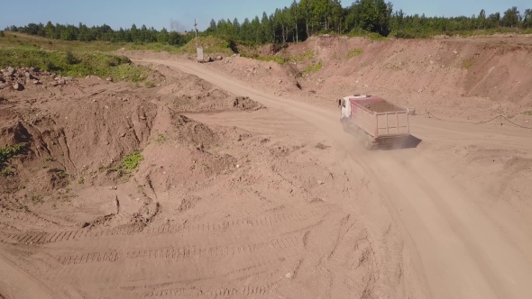 View From the Air of the Truck Driving on Sand Quarry