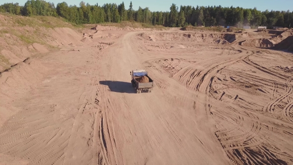 View From the Air of the Truck Driving on Sand Quarry