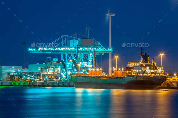 Freight Ship in a harbor at night - Stock Photo - Images