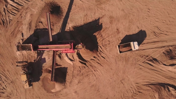 Aerial View of Loading Sand Into Trucks
