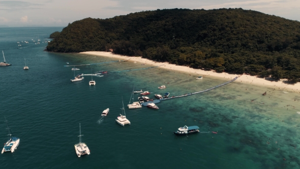 Thailand Coral Island Drone Shot Small Sports Boats, Large Catamarans, Fishing Schooners