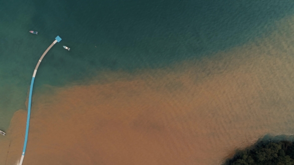 Thailand Coral Island Drone Shot Water Dyed in the Color of Sand After Tropical Rain Mingles