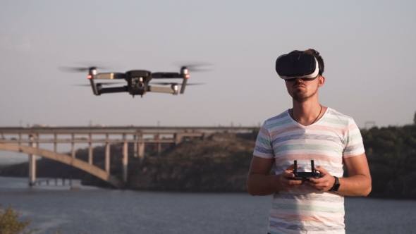 Man in VR Glasses Controlling Drone alt