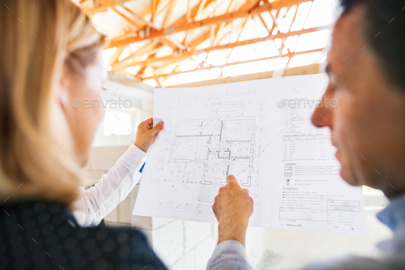 Unrecognizable architects at the construction site. - Stock Photo - Images