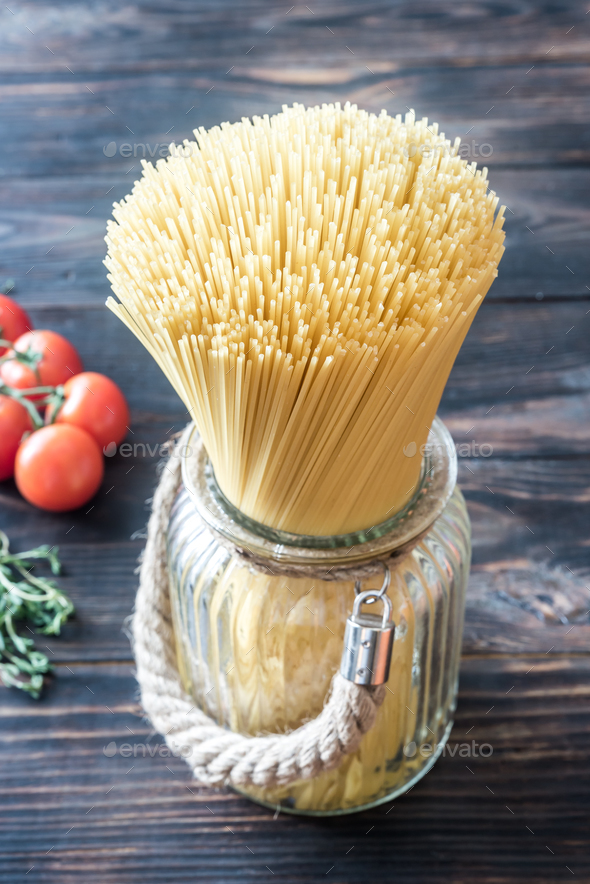 Uncooked spaghetti in the glass Stock Photo by Alex9500 PhotoDune