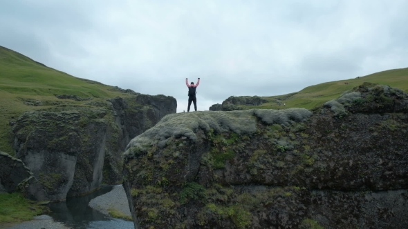 Hiker Raises His Arms Up and Screaming with Delight. Autumn Day. alt