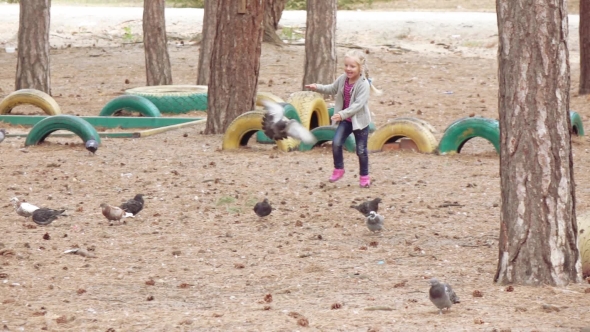 Girl Child Chasing Pigeons
