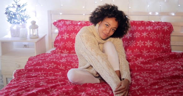 Young Woman Celebrating Alone at Christmas