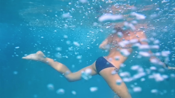 Girl Underwater in Swimming Pool