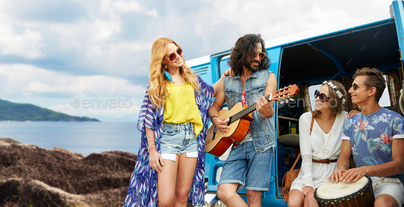 hippie friends playing music at minivan on island