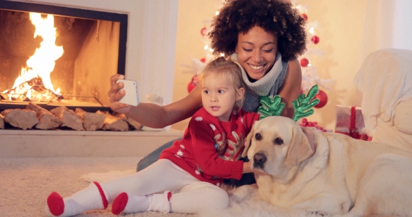 Mixed Race Family Taking Christmas Selfie