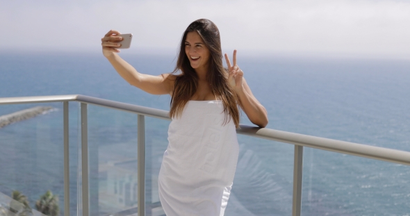 Content Girl Taking Selfie on Resort alt