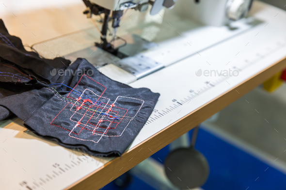 Sewing machine in cutting shop closeup, nobody - Stock Photo - Images