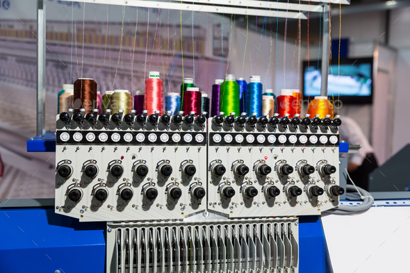 Sewing machine with spools of thread closeup - Stock Photo - Images