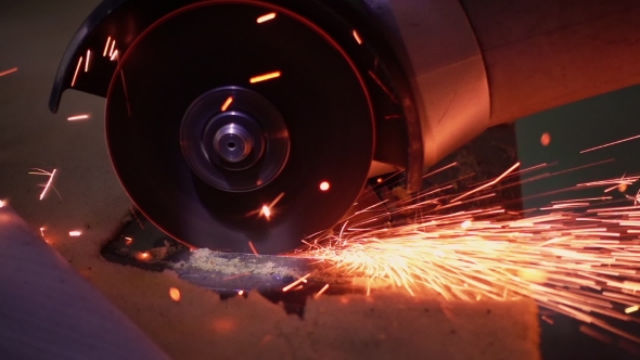 Cutting Metal with Disc Grinder with Bright Sparks