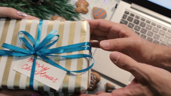 Woman Teasing Man with Gift Box alt