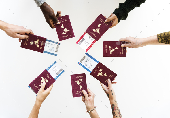 Group of Diverse Friendship Hands Show Passport with Plane Ticke
